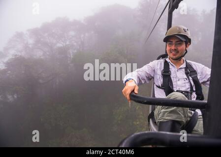 Ecuador. Riding the Mashpi Lodge sky bike in the Choco Rainforest, an area of cloud forest in the Pichincha Province of Ecuador, South America Stock Photo