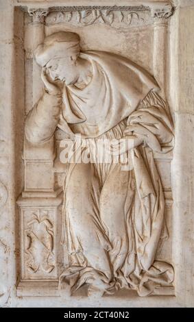 Basilica of Saint John Lateran, San Giovanni in Laterano, Rome. Marble tomb slab of a Lateran Canon Priest in the Cloisters First half 16th century Stock Photo