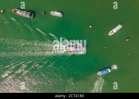 Vietnamese boats on the river. River pollution Stock Photo