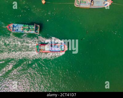 Vietnamese boats on the river. River pollution Stock Photo