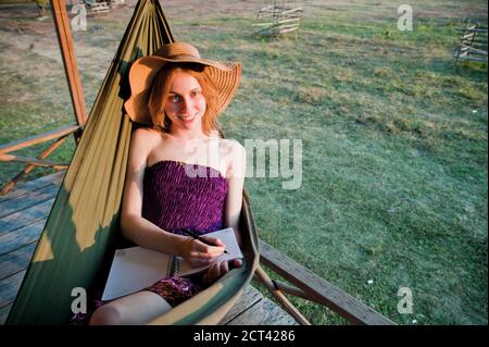 Tourist in a Hammock in Vang Vieng, Laos, Southeast Asia Stock Photo
