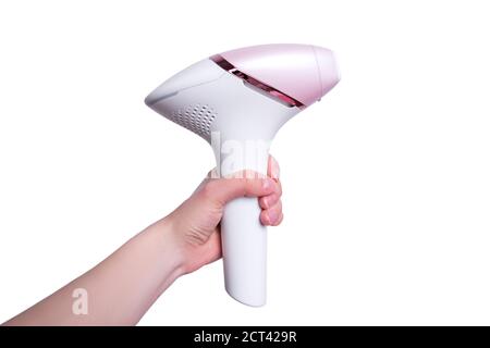 The girl holds a photoepilator in her hand. A device for removing unwanted hair isolated on white