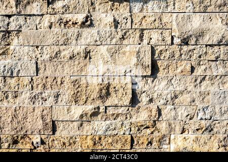 Stone wall brick texture background beige surface facade. Close - up. Hight quality photo Stock Photo