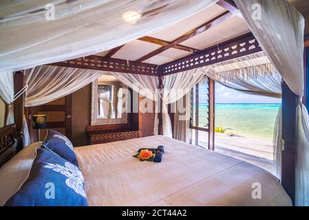 Bedroom with sea view over the tropical Pacific Ocean at luxury hotel accommodation, Muri, Rarotonga, Cook Islands Stock Photo