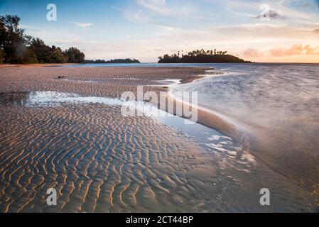 Sunrise at Muri Beach and tropical Motu Taakoka Island, Rarotonga, Cook Islands Stock Photo