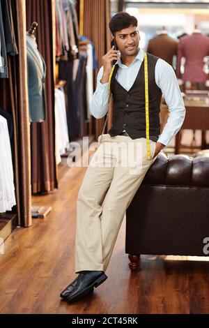 Atelier owner calling on phone Stock Photo