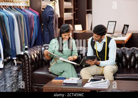Customer and tailor in atelier Stock Photo