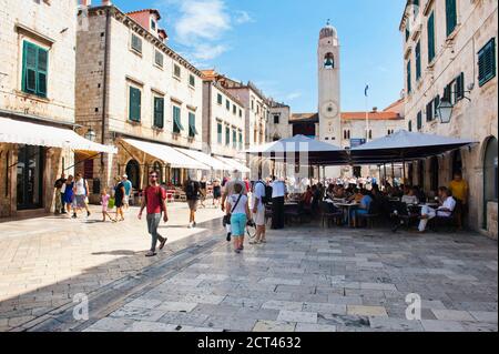 Cafe and City Bell Tower on Stradun, Dubrovnik, Dalmatia, Croatia Stock Photo