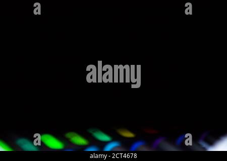 black background with defocused set of bright multicolored colorful felt-tip pens for drawing in the bottom Stock Photo