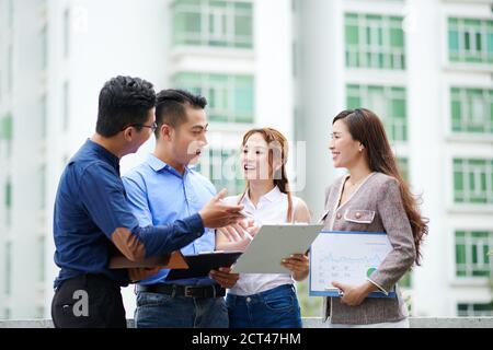 Business colleagues discussing news and reports Stock Photo