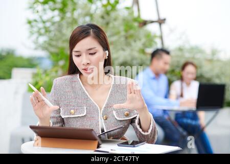 Entrepreneur having video call with team Stock Photo