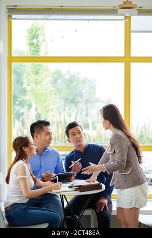 Business team at cafe table Stock Photo