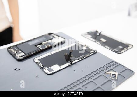 Workplace foreman service for repairing mobile phones, tools screwdriver, pliers mat Stock Photo