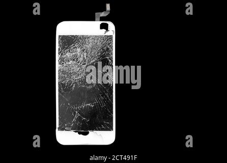 White mobile phone broken glass screen on black isolated background Stock Photo