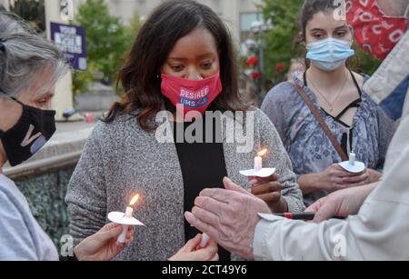 Dayton, United States. 20th Sep, 2020. Ohio Congressional candidate, Desiree Tims (center), lights her candle during a vigil honoring the life of the late Supreme Court Justice Ruth Bader Ginsburg, Credit: SOPA Images Limited/Alamy Live News Stock Photo