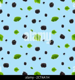 Falling Bramble Seamless pattern. Fresh Falling blackberry seamless pattern. Pattern with fresh wild berries isolated on blue background. Stock Photo