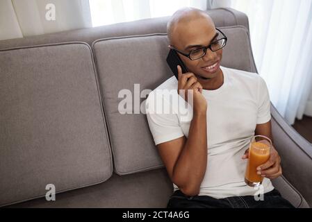 Man drinking fresh juice Stock Photo