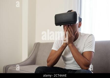 Shocked man in VR glasses Stock Photo