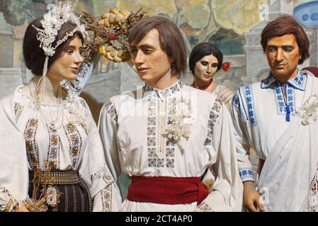 Group of people mannequins in traditional Eastern European folk costumes Stock Photo