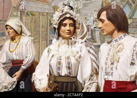 Mannequins of people in traditional Eastern European folk costumes Stock Photo