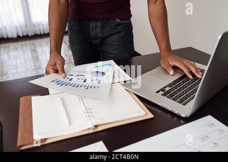 Financial analyst checking reports Stock Photo
