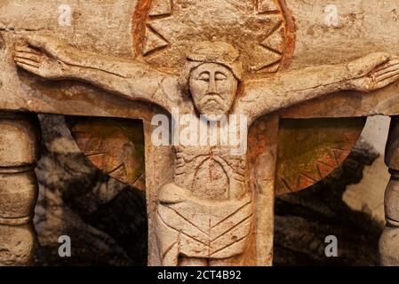 carved antique statue from limestone of Jesus Christ crucifixion Stock Photo