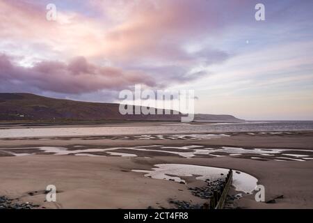 Wave breaks (groins) at sunrise, Barmouth Harbour, Gwynedd, North Wales, Wales, United Kingdom, Europe Stock Photo