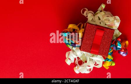 Christmas background with gift boxes and decorations on red.  Stock Photo