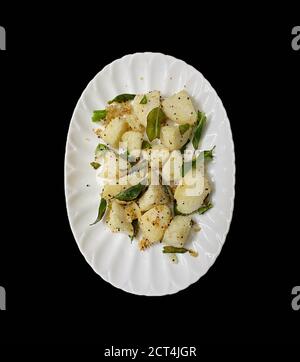 Delicious Seasoned or Fry Idly or idli served in a plate Stock Photo
