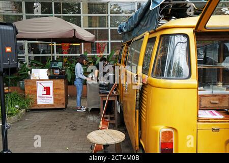 Exterior design and decoration of local coffee cafe decorated with Yellow van car- Chiang mai, Thailand Stock Photo