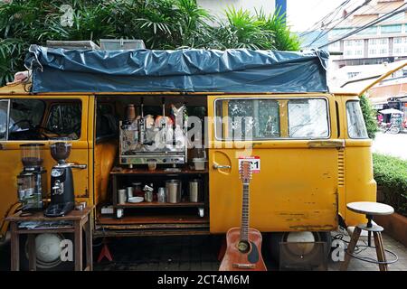 Exterior design and decoration of local coffee cafe decorated with Yellow van car- Chiang mai, Thailand Stock Photo