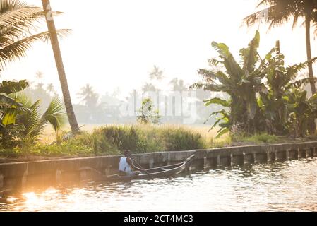 Dugout canoe fishing boat in the backwaters near Alleppey, Alappuzha, Kerala, India Stock Photo
