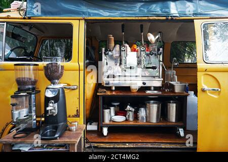 Exterior design and decoration of local coffee cafe decorated with Yellow van car- Chiang mai, Thailand Stock Photo