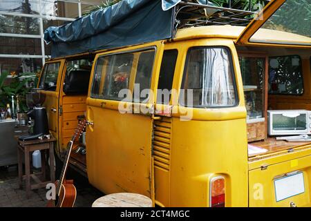 Exterior design and decoration of local coffee cafe decorated with Yellow van car- Chiang mai, Thailand Stock Photo