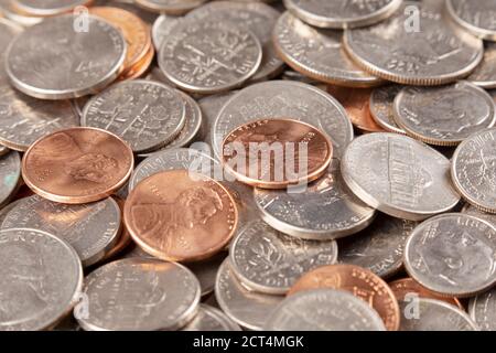 Background of the 4 most common American coins. Pennies, Dimes, Nickels, Quarters Stock Photo