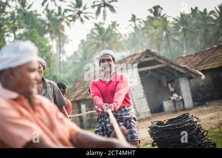 Fishermen at Kappil Beach, Varkala, Kerala, India Stock Photo
