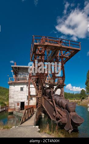 Boom with buckets at historical gold mining dredge at Sumpter in Blue Mountains, Oregon, USA Stock Photo