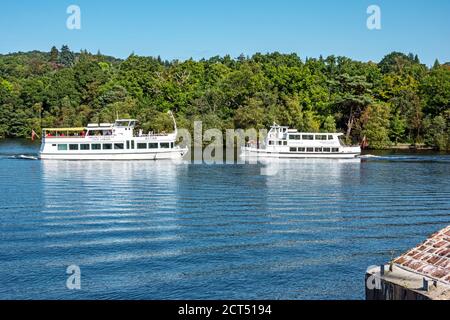 Sweeney's Cruise Co. Astina and Silver Martin pass each other at Loch Lomond Shores Balloch West Dunbartonshire Scotland UK Stock Photo