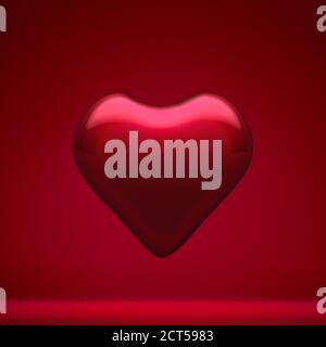 Romantic glossy red glass heart against red background. Christmas decoration, festive atmosphere concept. Stock Photo