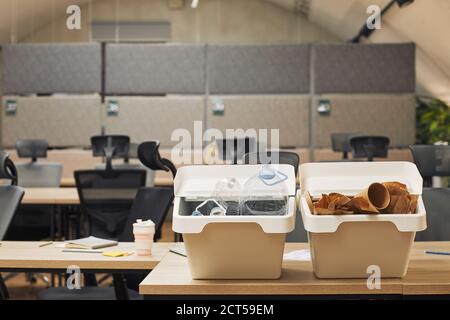 Background image of two waste sorting containers on desk in office interior, copy space Stock Photo