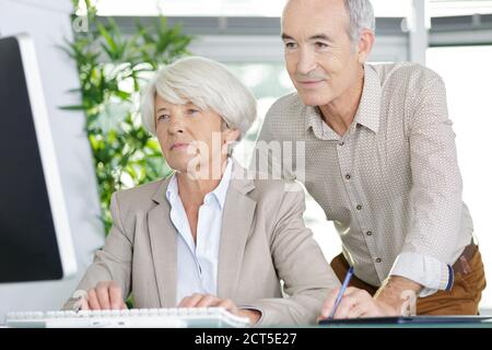 seniors learn in computer class about technology Stock Photo