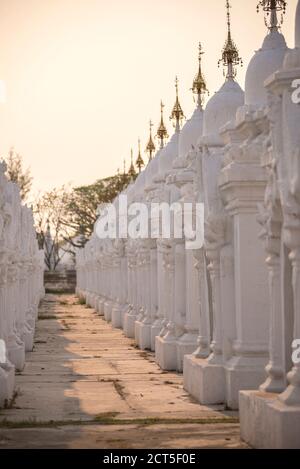 Stupas at sunset at Kuthodaw Pagoda, at the foot of Mandalay Hill, Mandalay Region, Myanmar (Burma) Stock Photo