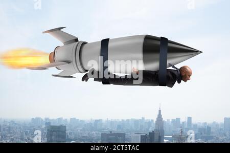 Businessman flies with a fast rocket. Concept of ambition and determination Stock Photo