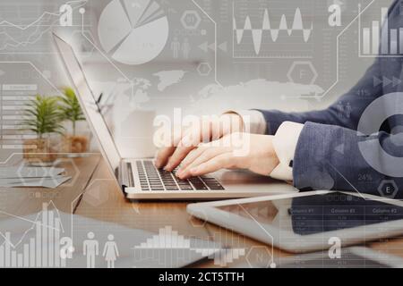 Digital marketing. Interactive screen with business processes over businessman typing on laptop Stock Photo