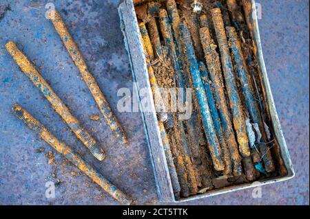 Old metal studs covered in rust, close-up, selective focus Stock Photo