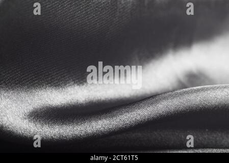 Abstract black and white textile texture with selective focus on crease Stock Photo