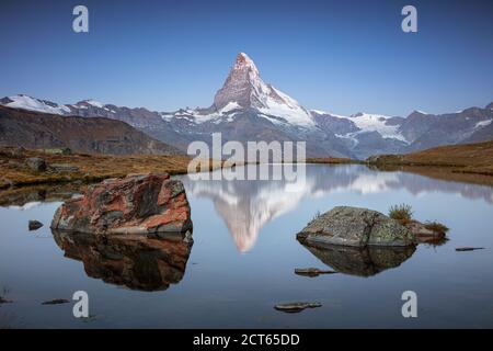 Matterhorn, Swiss Alps. Landscape image of Swiss Alps with Stellisee and Matterhorn in the background during sunrise. Stock Photo