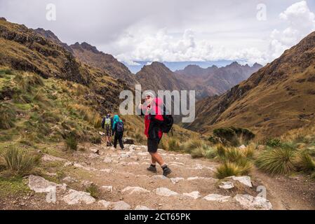 Hiking down from Dead Womans Pass 5,200m summit, Inca Trail Trek day 2, Cusco Region, Peru, South America Stock Photo