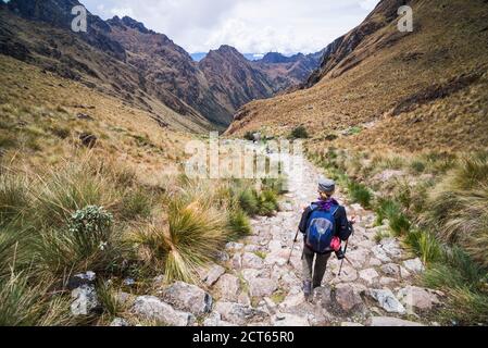 Hiking down from Dead Womans Pass 5,200m summit, Inca Trail Trek day 2, Cusco Region, Peru, South America Stock Photo