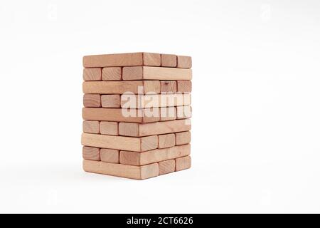 Wooden blocks stacked on white background. Accumulation, saving, safety or building in business concept. Stock Photo